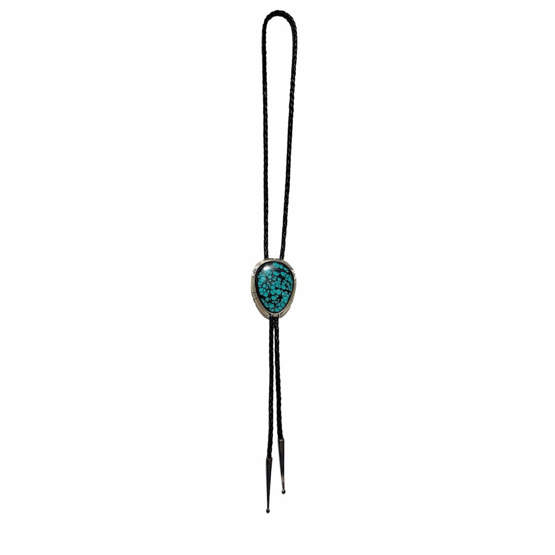 1990’S BRUCE WOOD (NAVAJO, 1974-2017) MASTER SILVERSMITH .925 STERLING SILVER &amp; KINGMAN HIGH GRADE SPIDERWEB MATRIX TURQUOISE CABOCHON BRAIDED LEATHER BOLO TIE