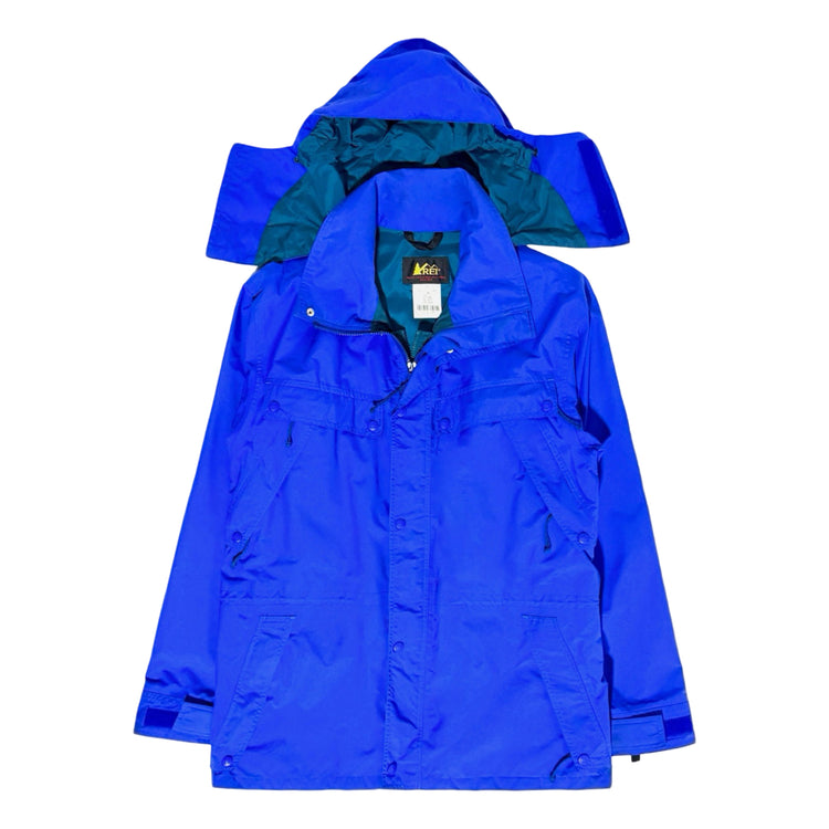 REI blue rain jacket folded