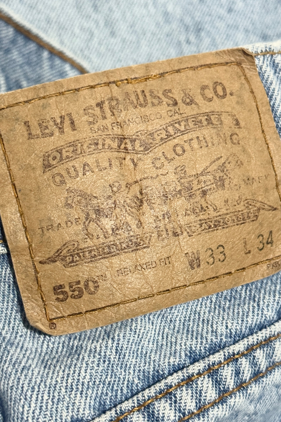1990’S LEVI’S 550 ORANGE TAB FADED LIGHT WASH BAGGY DENIM JEANS 32 X 34