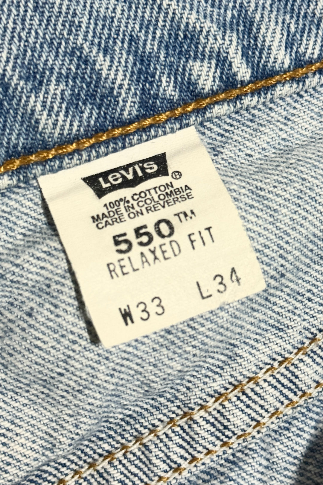 1990’S LEVI’S 550 ORANGE TAB FADED LIGHT WASH BAGGY DENIM JEANS 32 X 34
