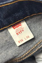 Load image into Gallery viewer, 1980’S LEVI’S MADE IN USA ORANGE TAB 517 WESTERN HIGH WAISTED BOOT CUT DENIM JEANS 34 X 36
