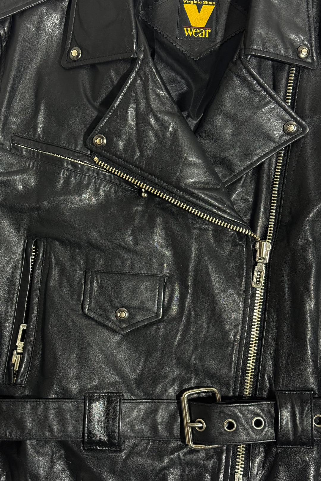 1990’S VIRGINIA SLIMS “V WEAR” CROPPED BLACK LEATHER ASYMMETRICAL MOTORCYCLE BIKER JACKET WOMEN’S LARGE / MEN’S MEDIUM
