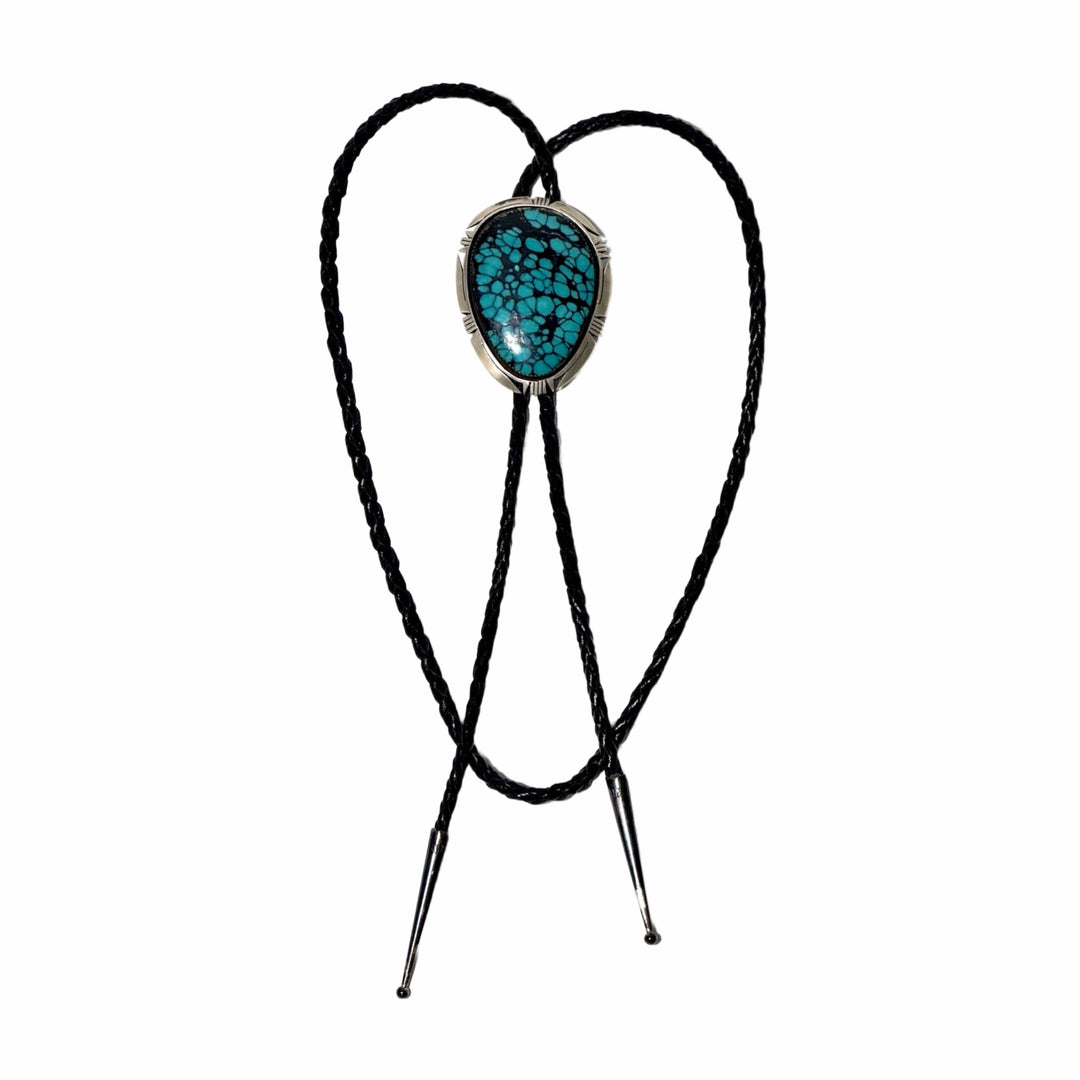 1990’S BRUCE WOOD (NAVAJO, 1974-2017) MASTER SILVERSMITH .925 STERLING SILVER &amp; KINGMAN HIGH GRADE SPIDERWEB MATRIX TURQUOISE CABOCHON BRAIDED LEATHER BOLO TIE