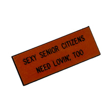 Load image into Gallery viewer, 1970’S SEXY SENIORS PIN (ORANGE)
