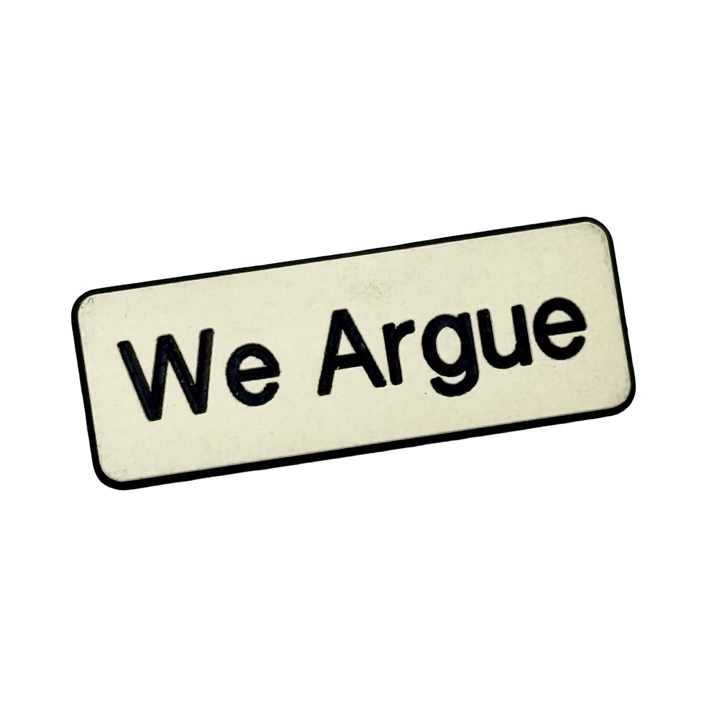 1970’S WE ARGUE PIN (WHITE)