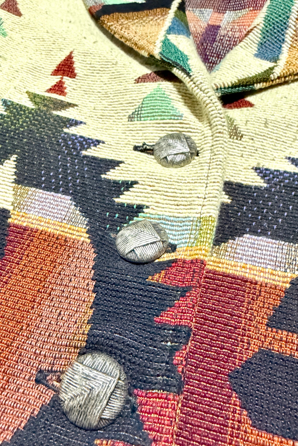 Textured silver tone button detail