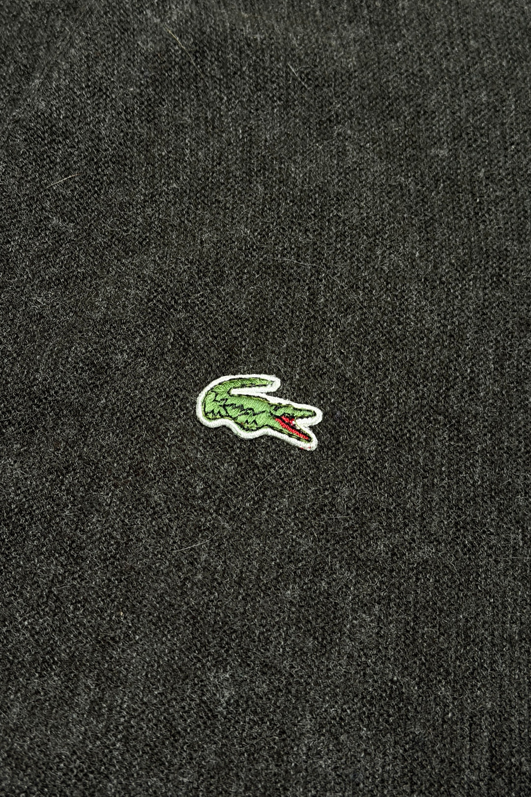 Embroidered crocodile logo detail