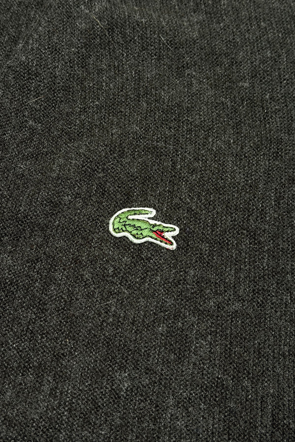 Embroidered crocodile logo detail