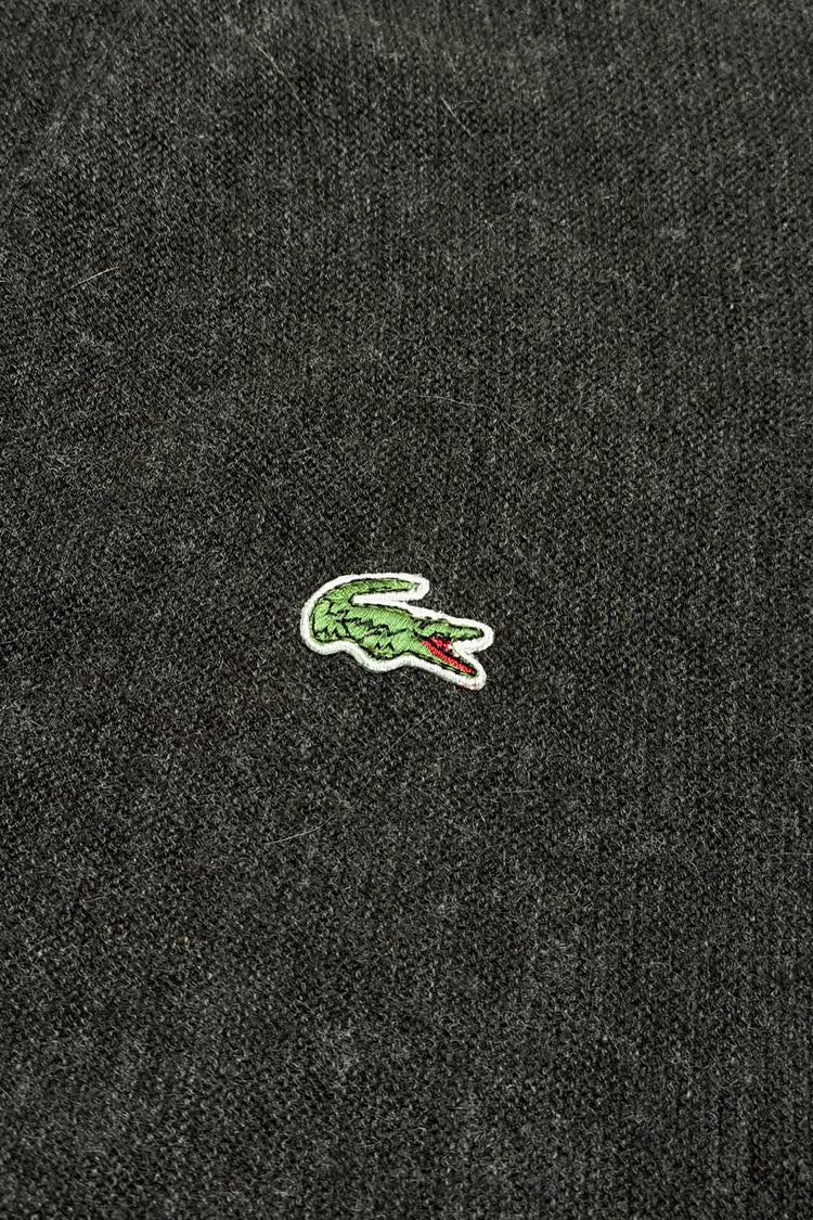Embroidered crocodile logo detail