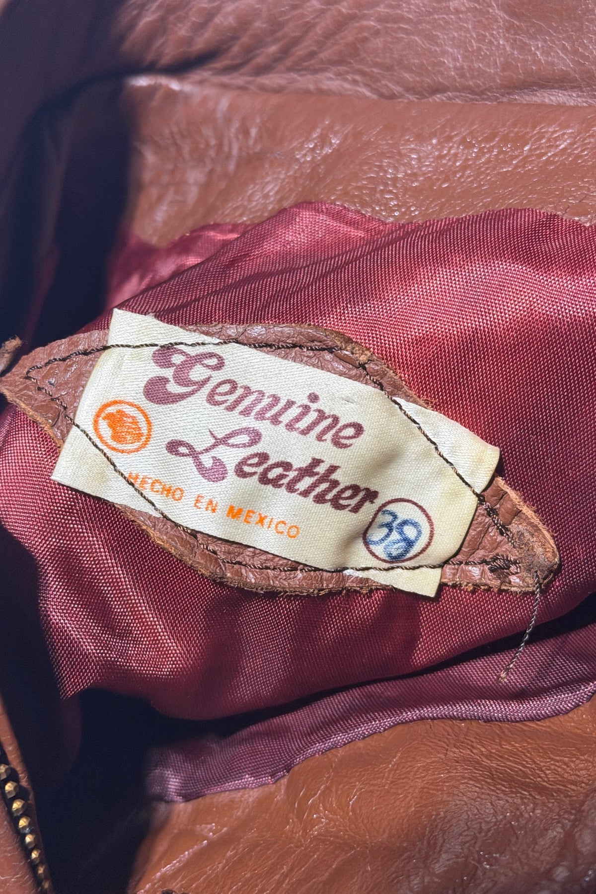 Leather bomber jacket tag