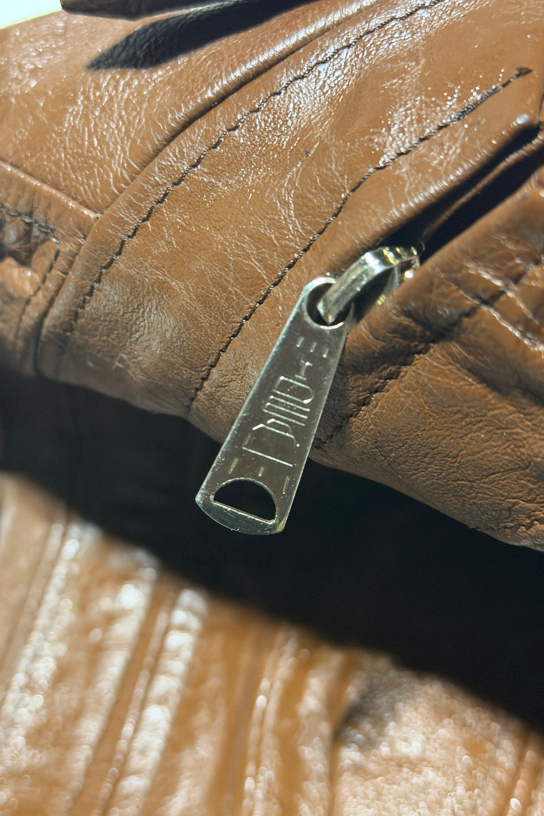 Leather bomber jacket zipper