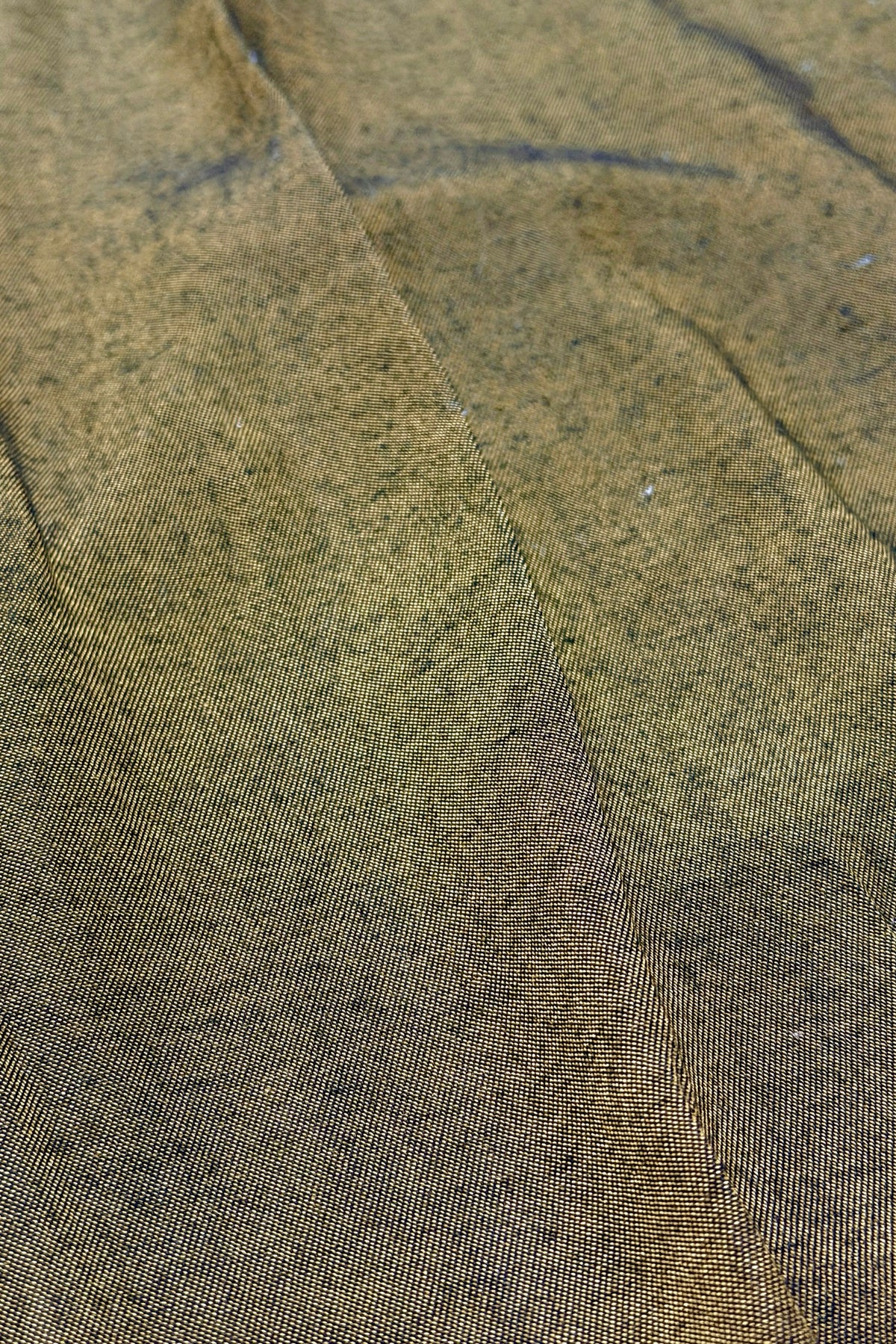 Black and gold sharkskin fabric close-up
