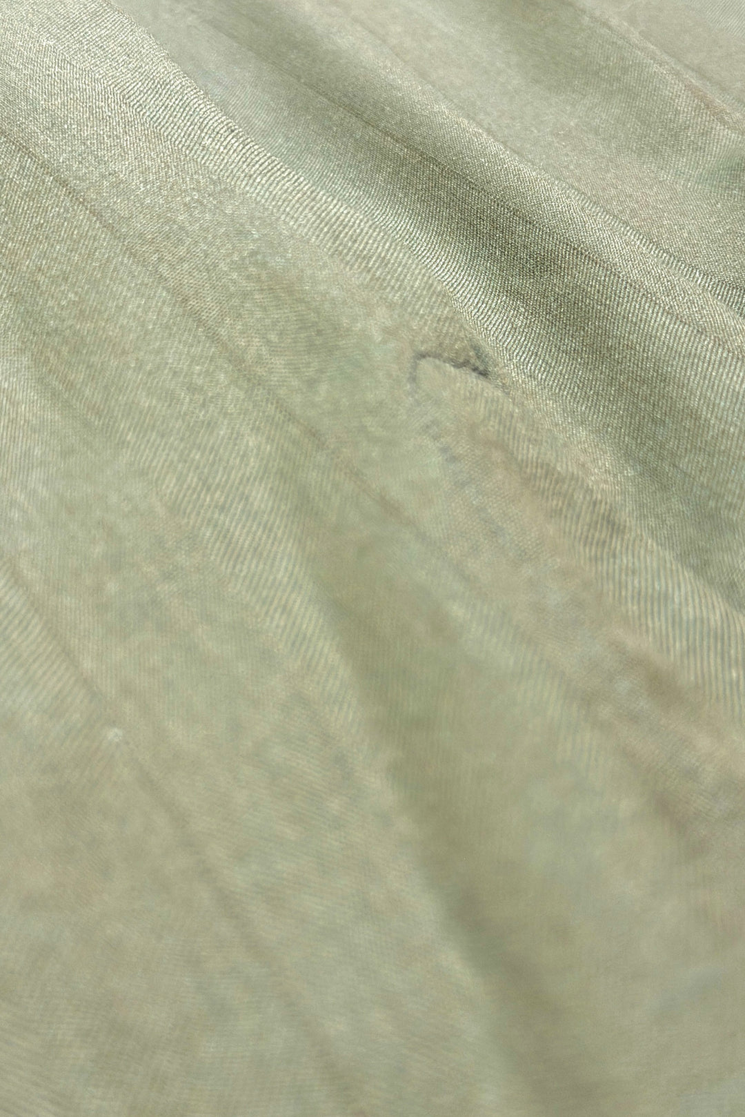 Gray green sharkskin fabric close-up