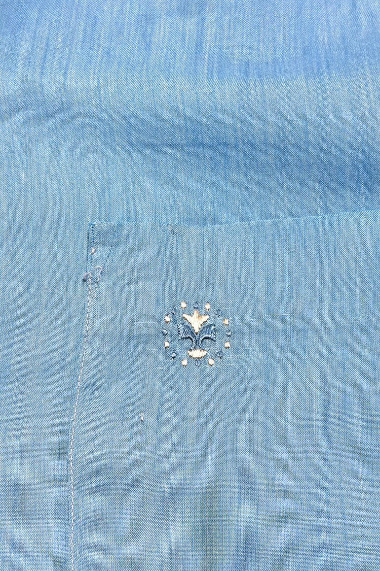 Embroidered floral crest on chest pocket