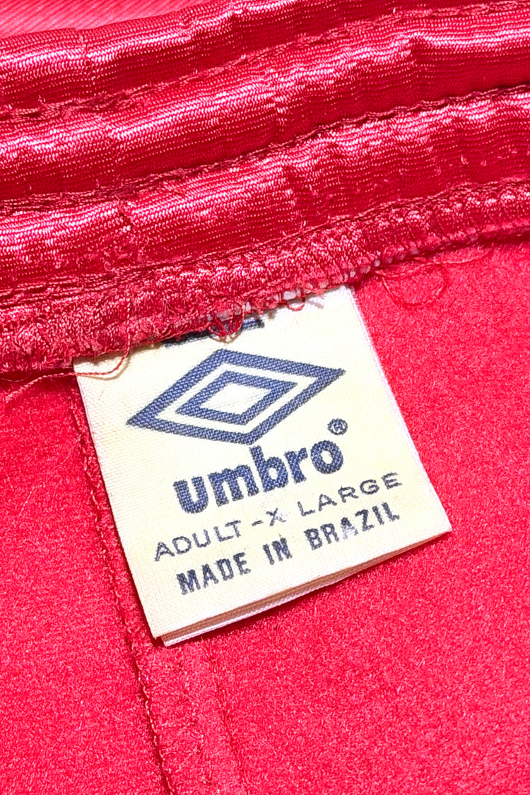Umbro red track pants tag