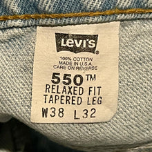 Load image into Gallery viewer, 1990’S LEVI’S 550 RELAXED FIT LIGHT WASH DENIM 36 X 31
